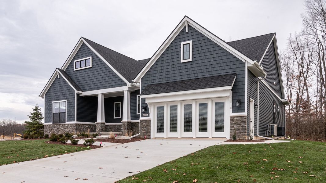 Front exterior of a new home in Preserve at Magnolia Park, Jackson, MI, highlighting curb appeal (Image 29).