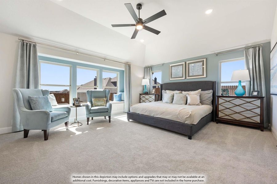 Spacious master bedroom with vaulted ceiling, ceiling fan, carpet floors, and large windows with seating area. Spacious master bedroom with vaulted ceiling, ceiling fan, carpet floors, and large windows with seating area.