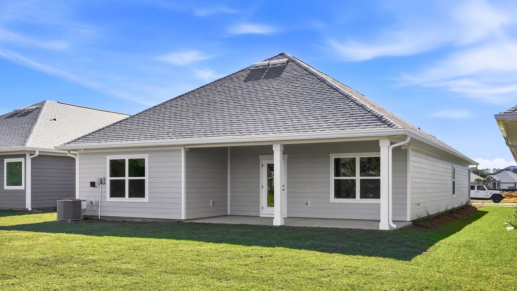 Exterior details and patio area of a home in Caballeros Estates At Hombre, Panama City Beach (Image 3).