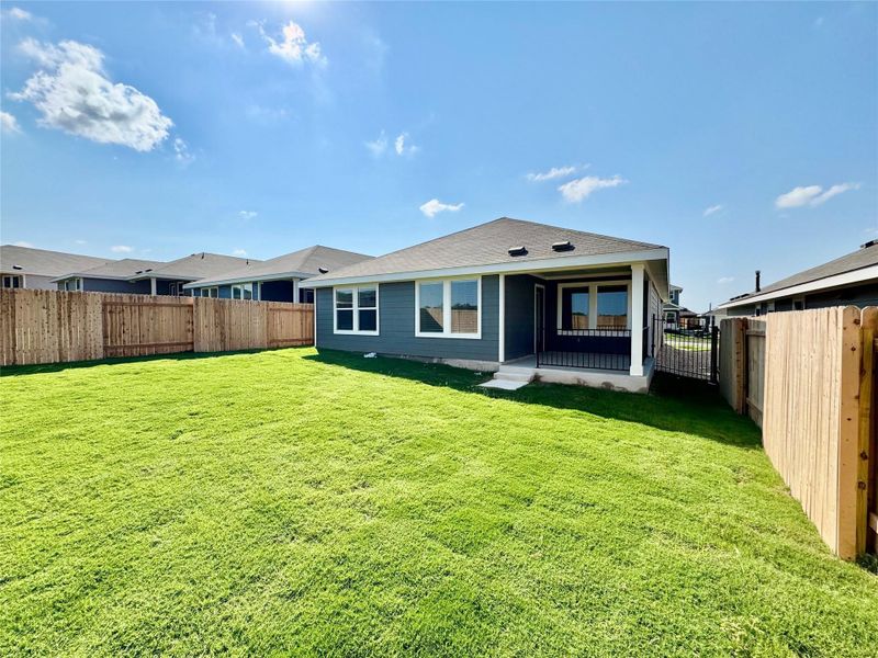 Rear view of property with a fenced backyard and a patio Rear view of property with a fenced backyard and a patio