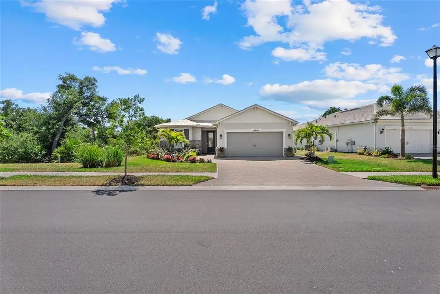 Front exterior of a new home in , Englewood, FL, highlighting curb appeal (Image 2).