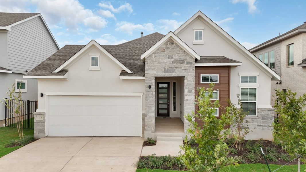 Front exterior of a new home in Berry Creek Highlands, Georgetown, TX, highlighting curb appeal (Image 21).