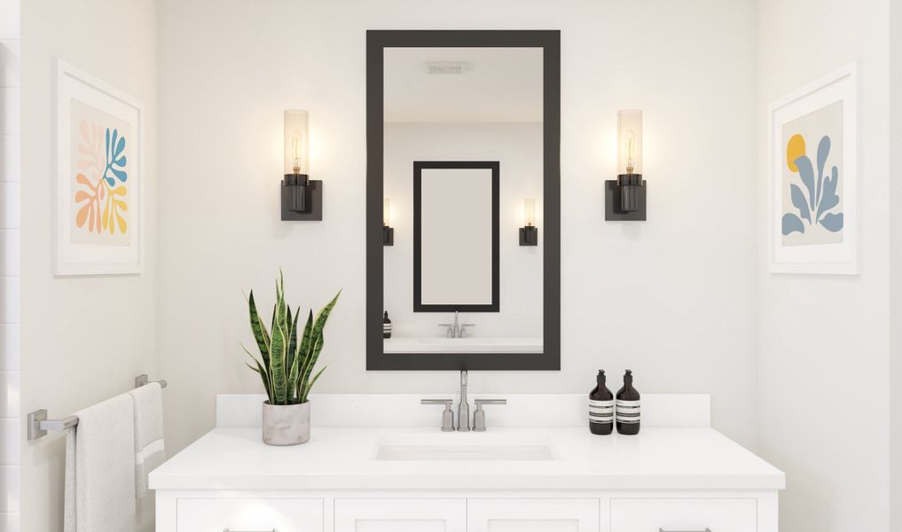 Primary bath with single-sink vanity and black framed mirrors