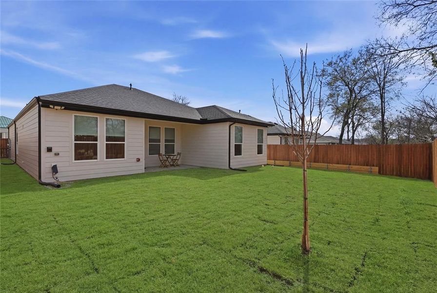 Back of property featuring a fenced backyard, a patio, and roof with shingles Back of property featuring a fenced backyard, a patio, and roof with shingles