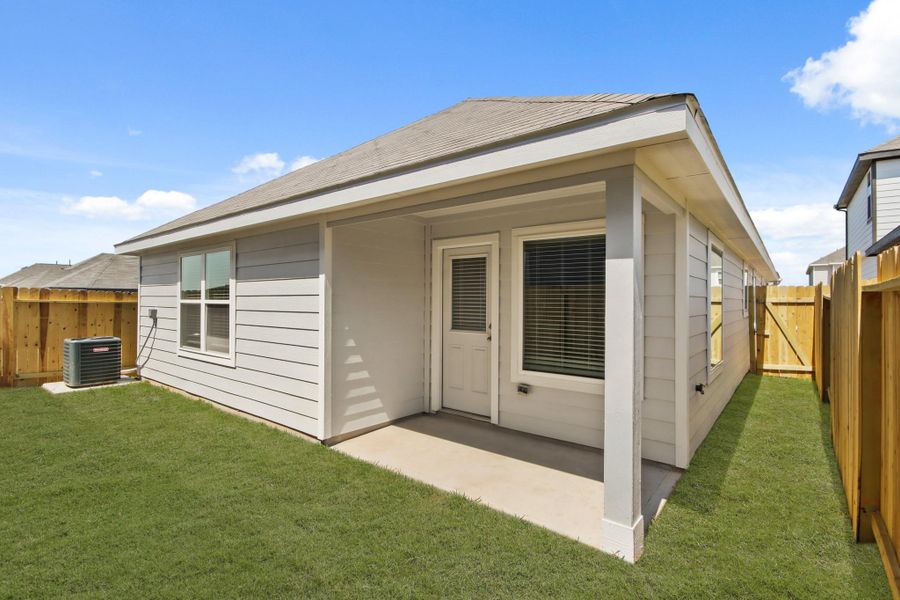 Front exterior of a new home in Ridgeland Hills, Willis, TX, highlighting curb appeal (Image 2).