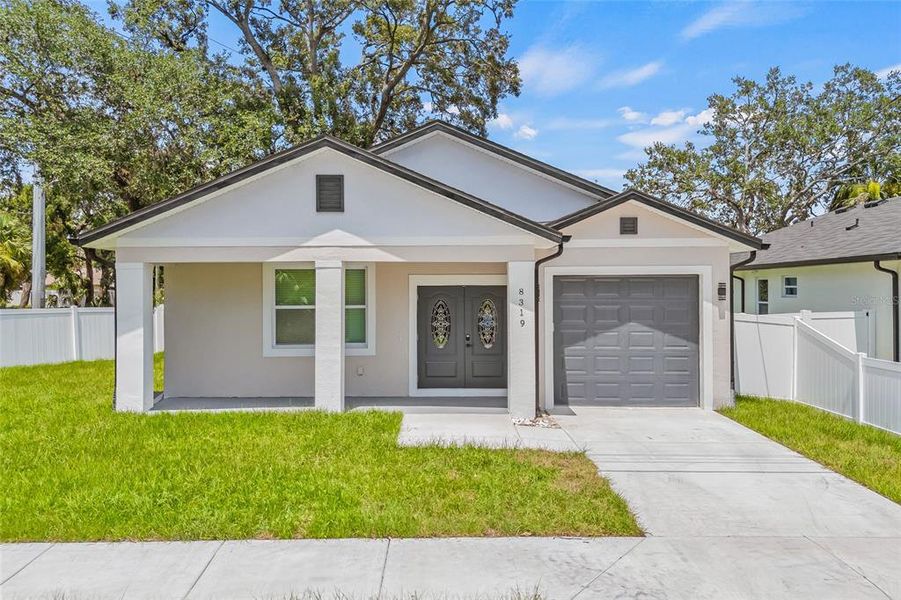 Front exterior of a new home in , Tampa, FL, highlighting curb appeal (Image 2).