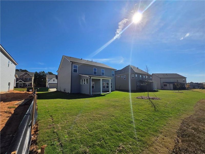 Exterior details and patio area of a home in Enclave at Logan Point, Loganville (Image 27).