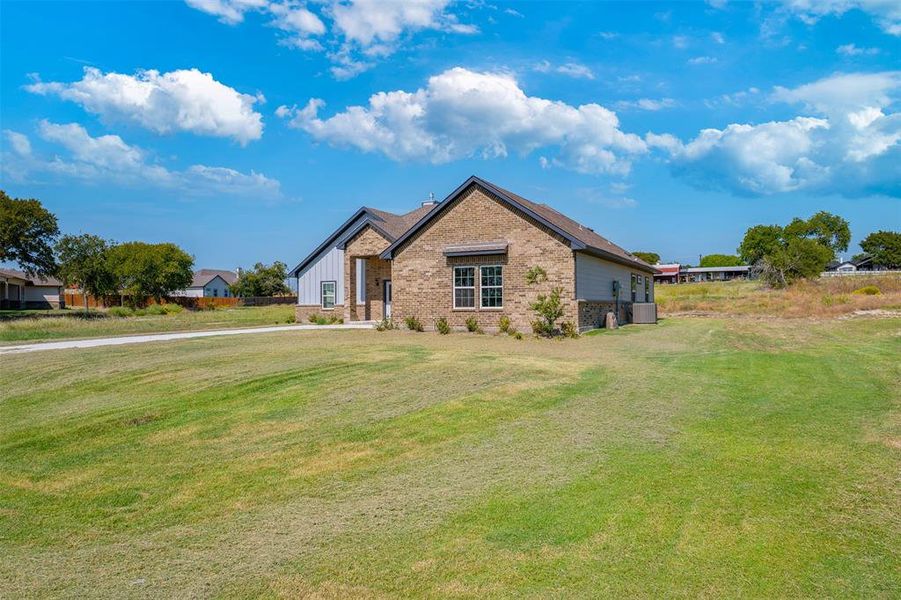 Front exterior of a new home in , Azle, TX, highlighting curb appeal (Image 27).