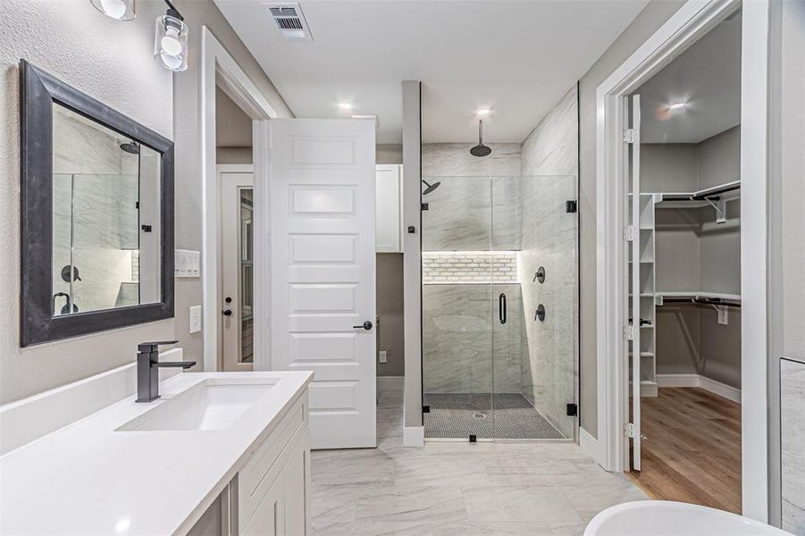 Master bathroom with walk-in closet Master bathroom with walk-in closet