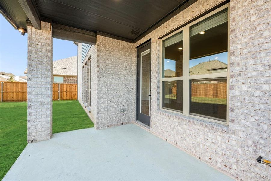Exterior details and patio area of a home in Creekview Meadows, Pilot Point (Image 23).