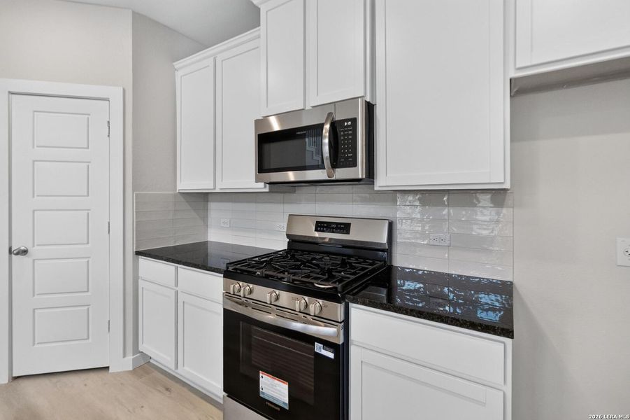 Furnished interior view inside a new home in Hickory Ridge, Elmendorf (Image 9).