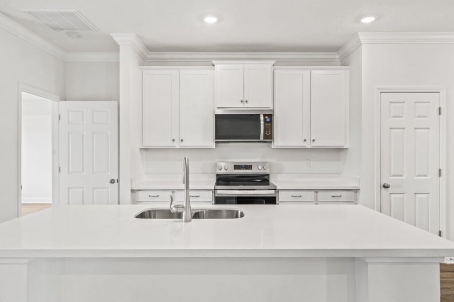 Furnished interior view inside a new home in Natureview, Freeport (Image 9).