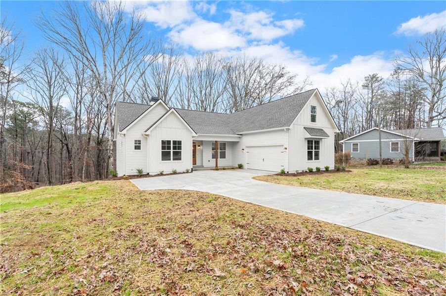 Front exterior of a new home in , Waleska, GA, highlighting curb appeal (Image 23). Front exterior of a new home in , Waleska, GA, highlighting curb appeal (Image 23).