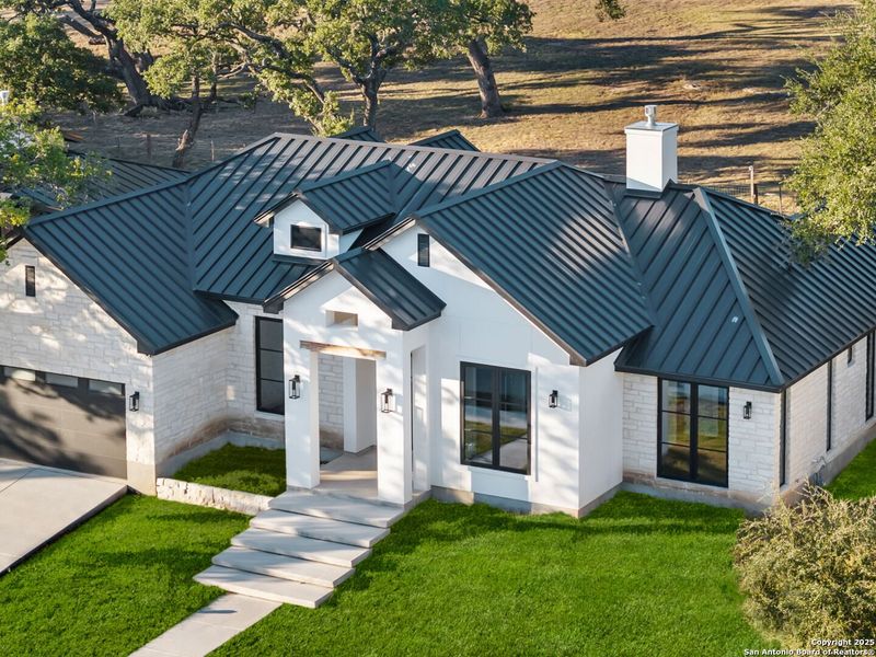 Front exterior of a new home in , Boerne, TX, highlighting curb appeal (Image 28).
