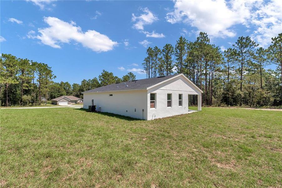 Front exterior of a new home in , Dunnellon, FL, highlighting curb appeal (Image 24).