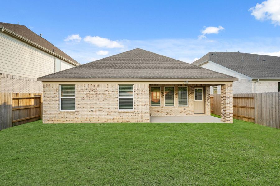 Front exterior of a new home in Sunterra North, Katy, TX, highlighting curb appeal (Image 9). Front exterior of a new home in Sunterra North, Katy, TX, highlighting curb appeal (Image 9).