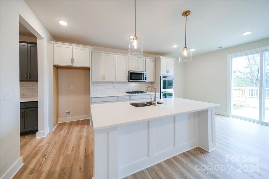 Large Trimmed Island w/ Upgraded Cabinets and Quartz Countertops