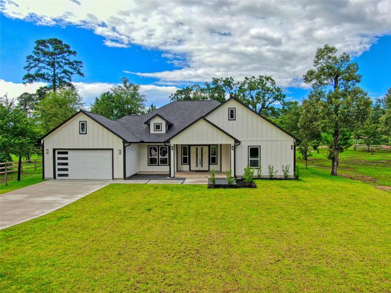 Front exterior of a new home in , Plantersville, TX, highlighting curb appeal (Image 25).