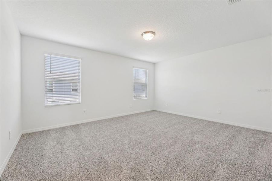 Spacious, unfurnished interior of a new home in The Meadow at Crossprairie Townes, St. Cloud (Image 22).