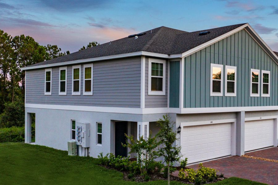 Exterior details and patio area of a home in Blue Springs Reserve Townhomes, Groveland (Image 10).