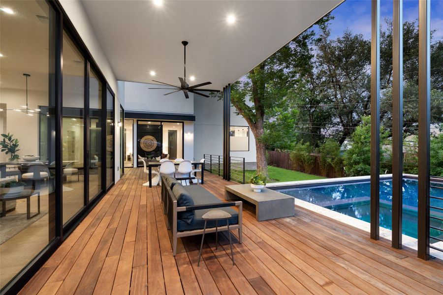 Wooden deck featuring a ceiling fan Wooden deck featuring a ceiling fan