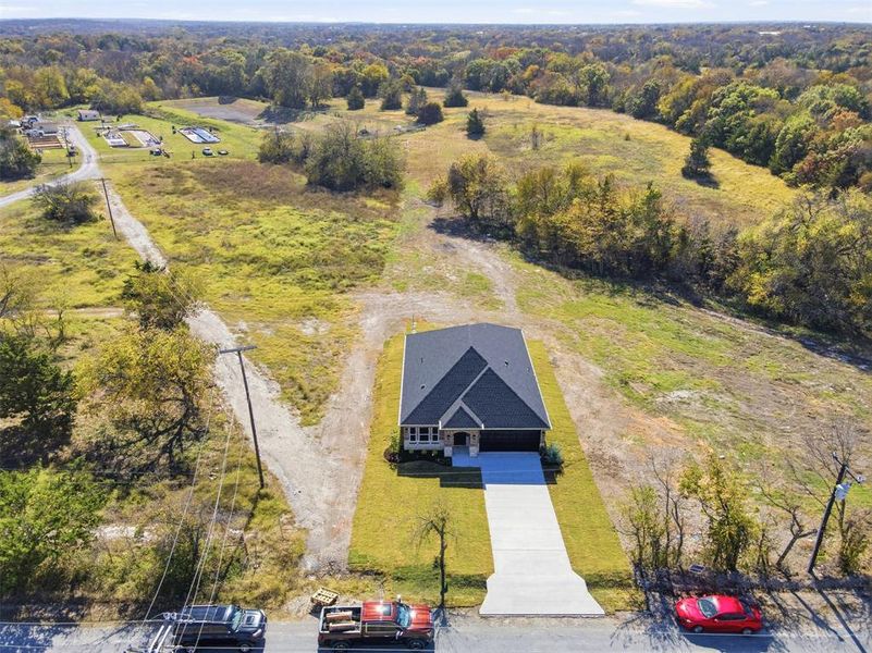 Front exterior of a new home in , Tom Bean, TX, highlighting curb appeal (Image 18).