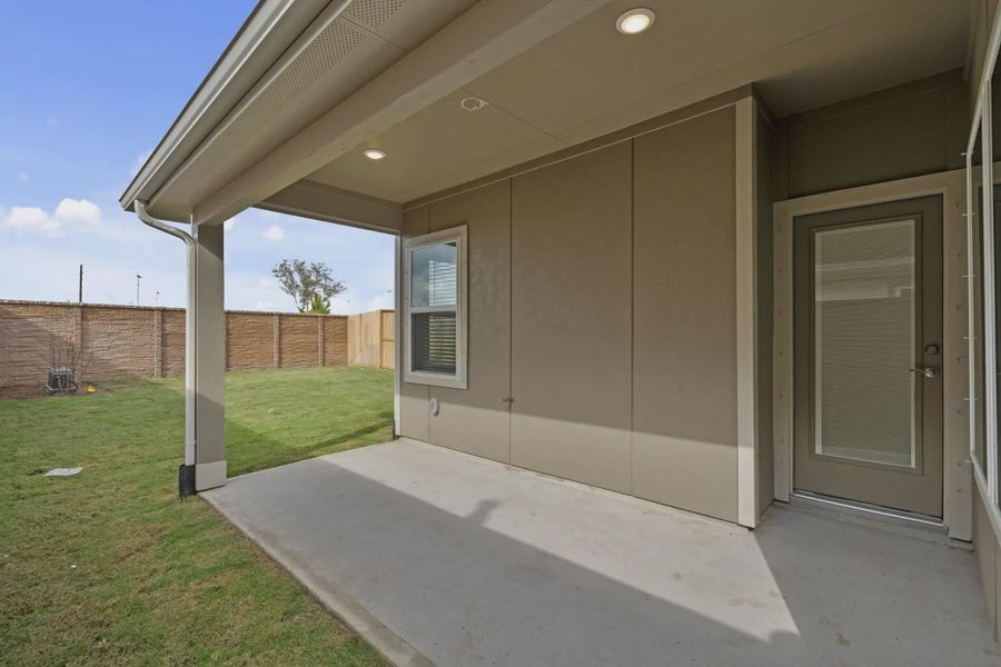 Representative exterior details of a home built from the Carriagehouse by Chesmar Homes in Meridiana Townhomes, Iowa Colony (Image 45).