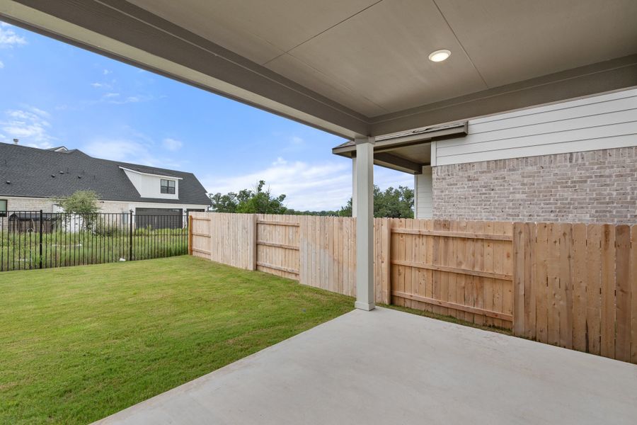 Exterior details and patio area of a home in Lariat, Liberty Hill (Image 4).
