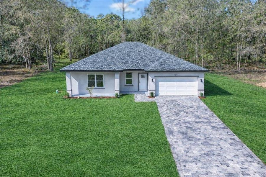 Front exterior of a new home in , Citrus Springs, FL, highlighting curb appeal (Image 21).