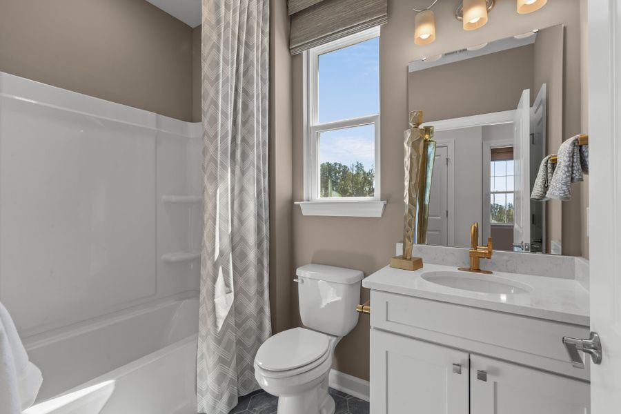 Representative furnished interior of a home built from the The Sunflower by Chesapeake Homes in Coastal Club of the Carolinas, Calabash (Image 18).