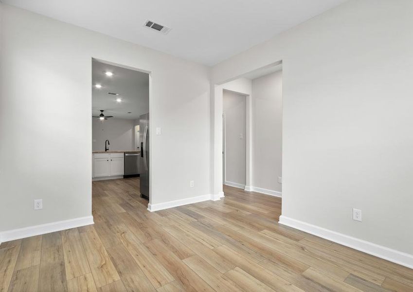 Connected to the kitchen, this open room makes the perfect home office!