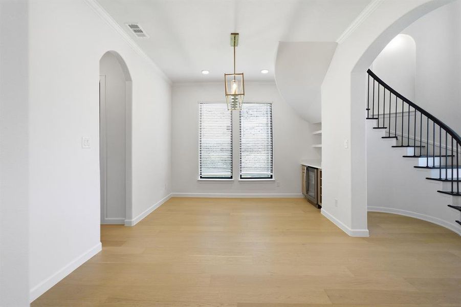 Open concept living space featuring light wood-finish flooring Open concept living space featuring light wood-finish flooring