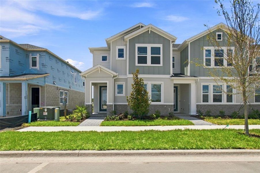 Front exterior of a new home in , St. Cloud, FL, highlighting curb appeal (Image 19).
