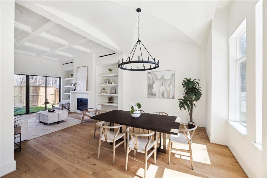 Unique Aesthetic - This dining room features an eye-catching groin vaulted ceiling, a six-candle black metal chandelier that lights up this extraordinary space. Designed for an oversized dining table with abundant space and  easy circulation seamlessly blending aesthetics with functionality.