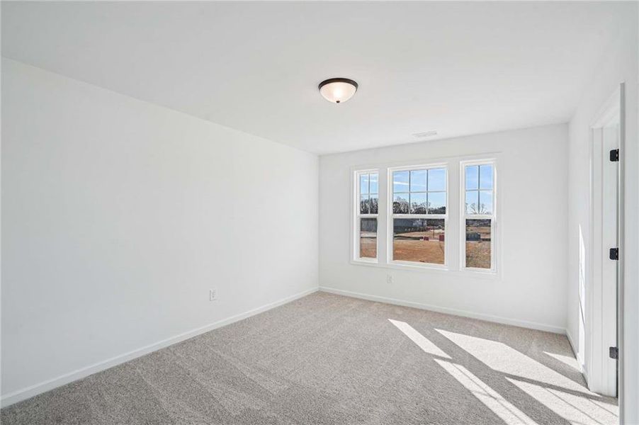 Spacious, unfurnished interior of a new home in Eastlyn Crossing - Single Family, Flowery Branch (Image 27). Spacious, unfurnished interior of a new home in Eastlyn Crossing - Single Family, Flowery Branch (Image 27).