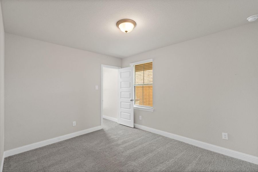 Spacious, unfurnished interior of a new home in Sunterra, Katy (Image 28).