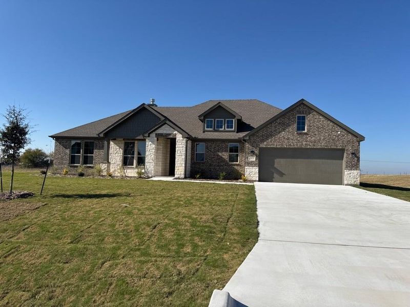 Front exterior of a new home in Fairview Meadows, New Fairview, TX, highlighting curb appeal (Image 1).