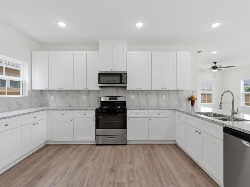 The easy connection between the kitchen and living area creates a welcoming atmosphere that’s perfect for everyday living and effortless hosting.