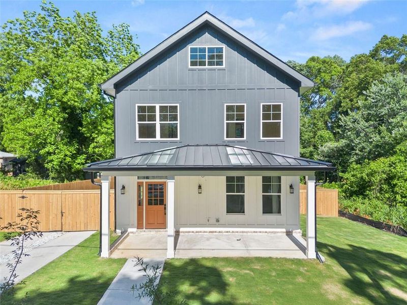 Front exterior of a new home in , Avondale Estates, GA, highlighting curb appeal (Image 1).