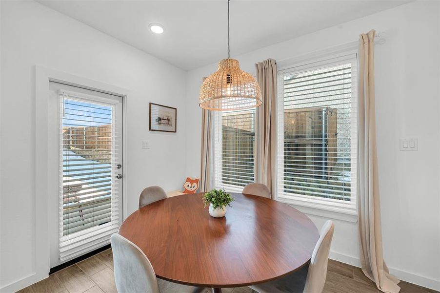 Dining room featuring hardwood / wood-style floors and a wealth of natural light