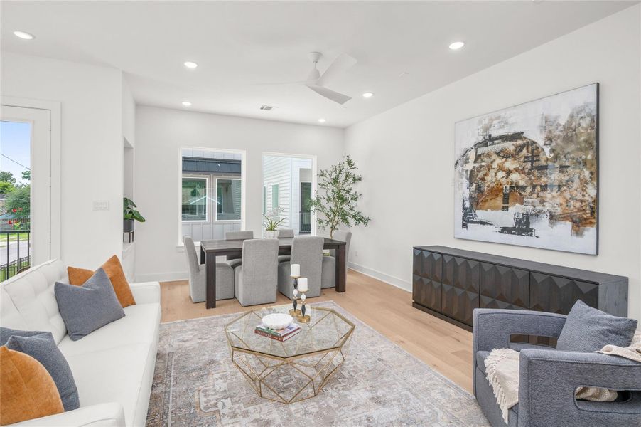 A view from the kitchen of the spacious living and dining room space.