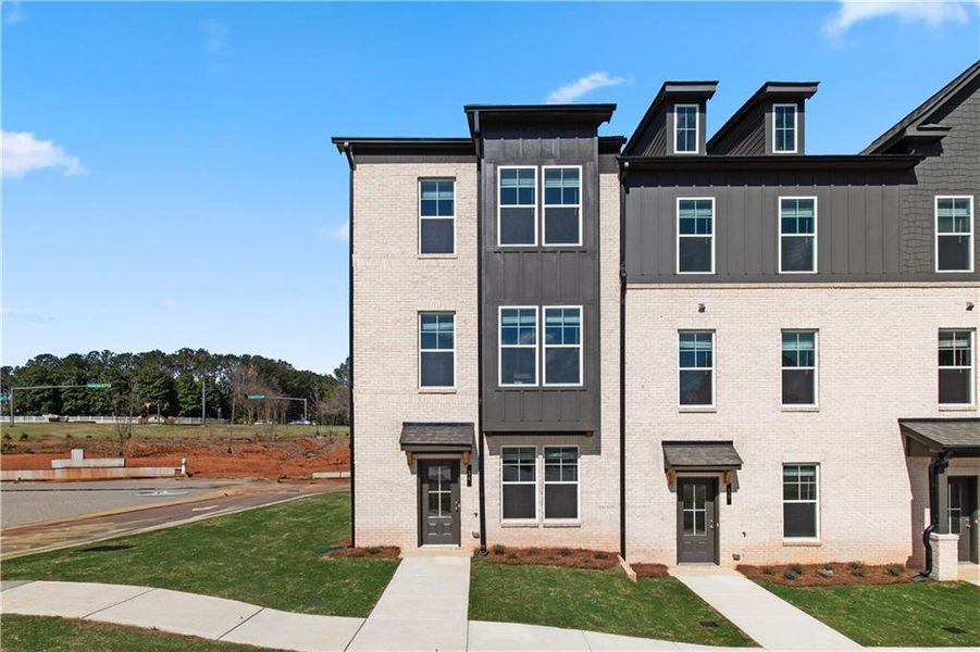 Front exterior of a new home in Daybreak, Newnan, GA, highlighting curb appeal (Image 14).