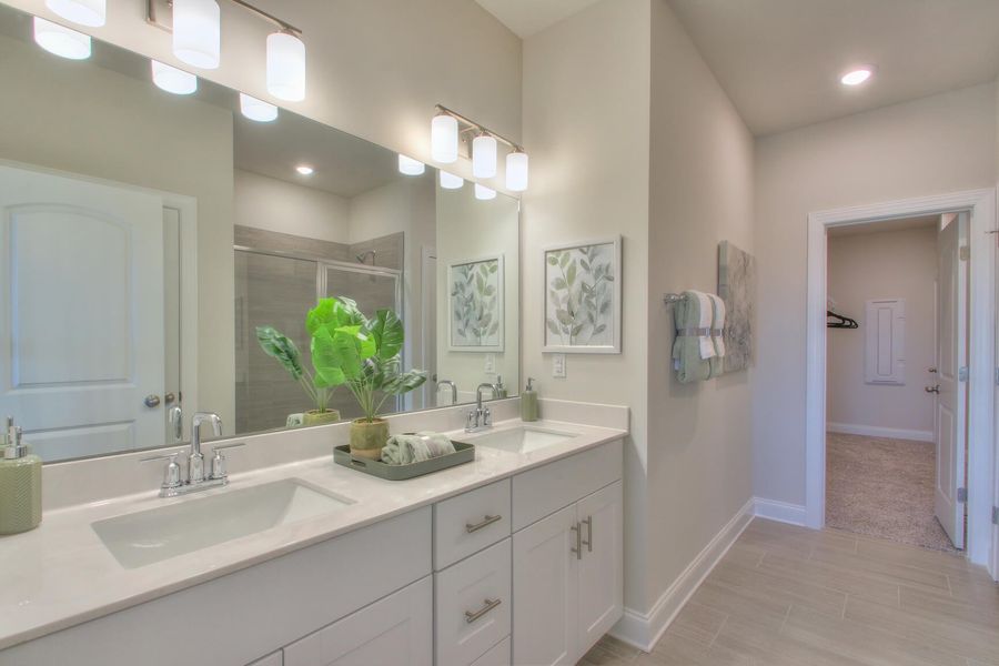 The primary bath offers a large walk-in shower. Photography from Skyridge in Nashville.