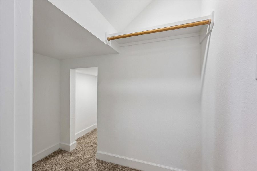 Spacious secondary bedroom closet featuring an additional interior closet, offering enhanced storage and organization. This thoughtfully designed layout provides the benefit of separating seasonal items, maximizing space, and keeping belongings neatly tucked away for a clean, clutter-free feel. Spacious secondary bedroom closet featuring an additional interior closet, offering enhanced storage and organization. This thoughtfully designed layout provides the benefit of separating seasonal items, maximizing space, and keeping belongings neatly tucked away for a clean, clutter-free feel.