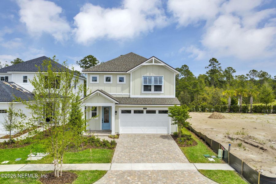 Front exterior of a new home in Seabrook Village at Seabrook, Ponte Vedra, FL, highlighting curb appeal (Image 26). Front exterior of a new home in Seabrook Village at Seabrook, Ponte Vedra, FL, highlighting curb appeal (Image 26).