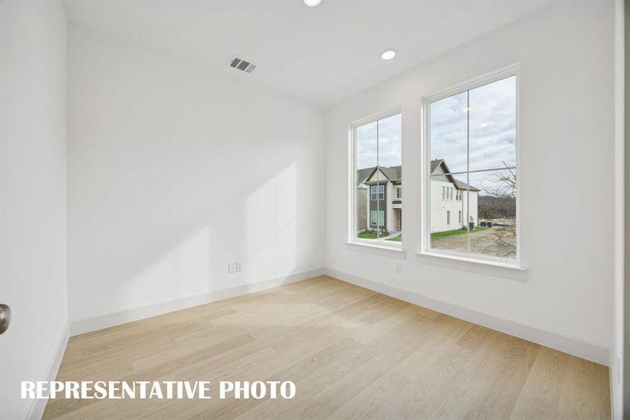 The professional working from home will appreciate this private home office with oversized windows providing tons of natural light. REPRESENTATIVE PHOTO The professional working from home will appreciate this private home office with oversized windows providing tons of natural light. REPRESENTATIVE PHOTO
