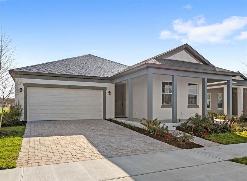 Front exterior of a new home in , Kissimmee, FL, highlighting curb appeal (Image 19).