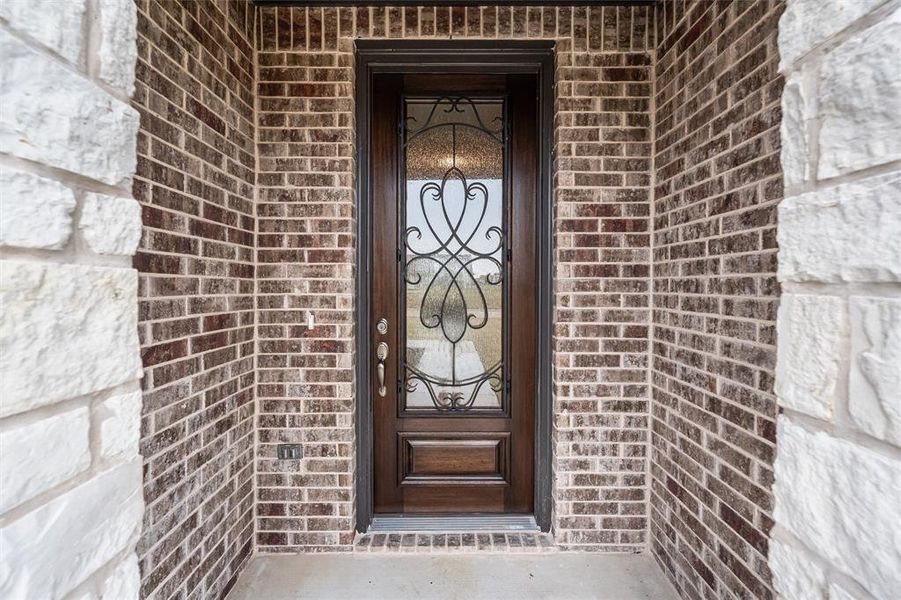 Property entrance with brick siding