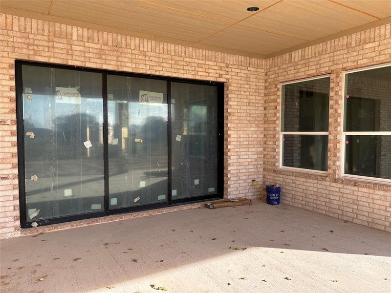 Property entrance with a patio area