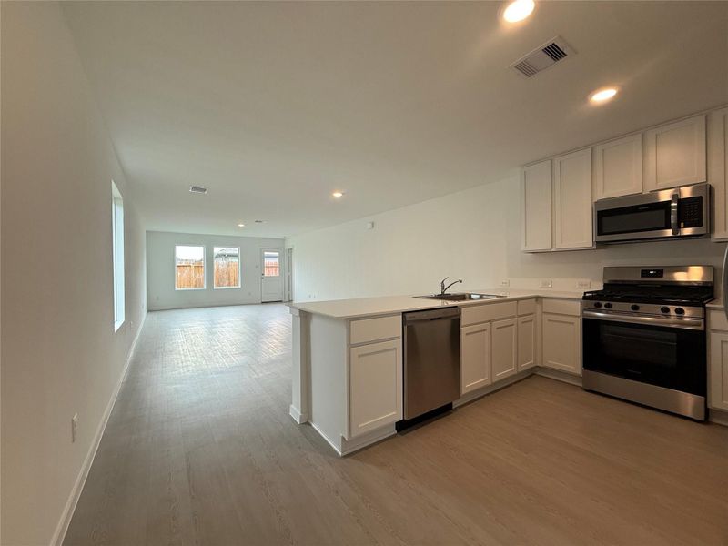 Furnished interior view inside a new home in Sweetgrass Village: Cottage Collection, Crosby (Image 5).